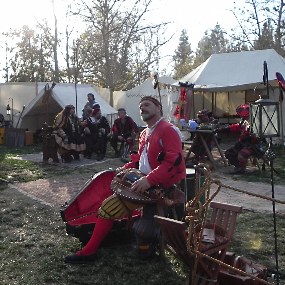 Nottingham Festival - German encampment with a kind gentleman playing a hurdy gurdy for the visitors - Festivals Near Me - Simi Valley, California Nottingham Festival - German encampment with a kind gentleman playing a hurdy gurdy for the visitors - Festivals Near Me - Simi Valley, California