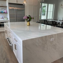 Wave Granite & Marble - Porcelain with waterfall edge.