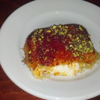 Tanoreen - Featured in "Best Thing I Ever Ate" on the Food Network -The dessert - Knafeh (cut in half) - Middle Eastern Near Me - Brooklyn, New York