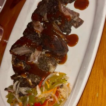Omar's Kitchen and Rum Bar - Jerk Goat Ribs. $19. Very good - Caribbean Near Me - New York, New York Omar's Kitchen and Rum Bar - Jerk Goat Ribs. $19. Very good - Caribbean Near Me - New York, New York