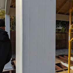 Backyard Showcase - Five pieces of wood sandwiched together with a paint job so poor that you can see each individual board.