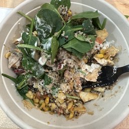 created my own bowl - spinach, quinoa, chicken, corn, crisps, garlic sauce