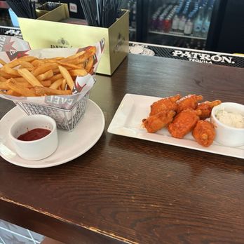 Level Sporting Club - Fries, Lollipop Wings (Buffalo) - Sports Bars Near Me - Chicago, Illinois Level Sporting Club - Fries, Lollipop Wings (Buffalo) - Sports Bars Near Me - Chicago, Illinois