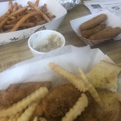Farmers One Stop - Chicken Tender Basket with Cajun Fries and Mozzarella Sticks in the background