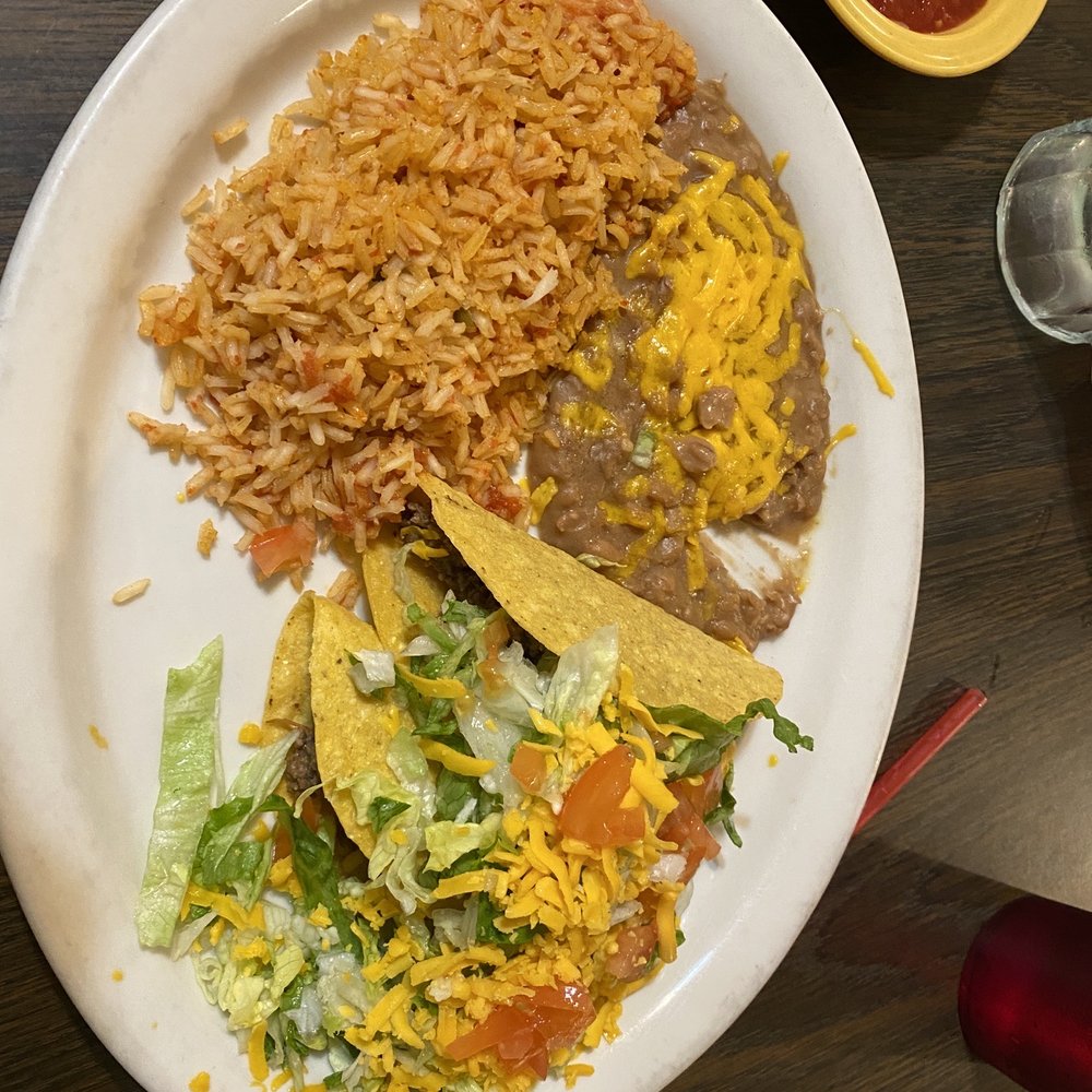 Beef tacos, beans, and rice.