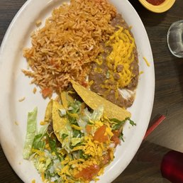 Beef tacos, beans, and rice.