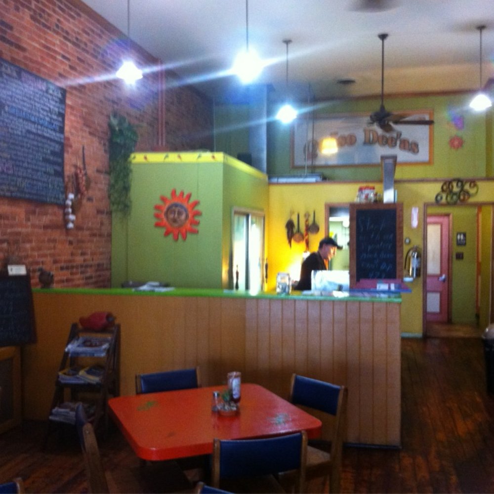 Interior. There are a few 4-person tables, one for larger groups, and window seats by the door. Interior. There are a few 4-person tables, one for larger groups, and window seats by the door.