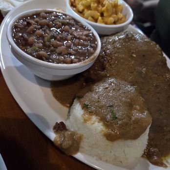 Cajun Soul Bistro & Bar - Smothered pork chops, truly smothered - Cajun/Creole Near Me - Cocoa, Florida