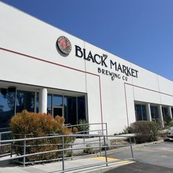 Front of Black Market Brewing - enter on the far right.