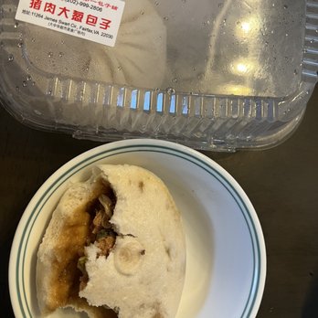 BaoBuddy - a half eaten baobob on a plate next to a plastic container - Dim Sum Near Me - Fairfax, Virginia