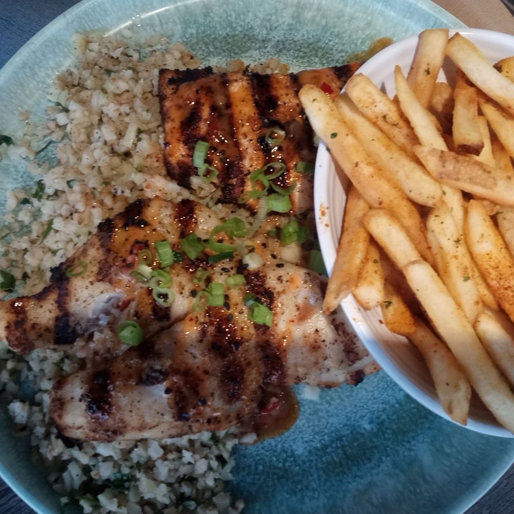 Salmon and swai with cauliflower rice and fries Salmon and swai with cauliflower rice and fries