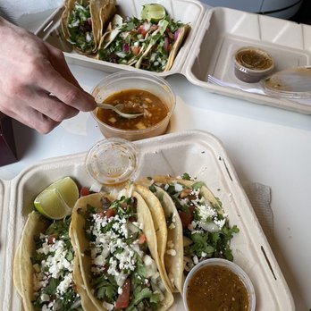 Fridas Kitchen - Top: one chicken, two beef tacos. Bottom: one pork, two beef tacos. Consomé soup in the center. - New Mexican Cuisine Near Me - Portland, Oregon Fridas Kitchen - Top: one chicken, two beef tacos. Bottom: one pork, two beef tacos. Consomé soup in the center. - New Mexican Cuisine Near Me - Portland, Oregon