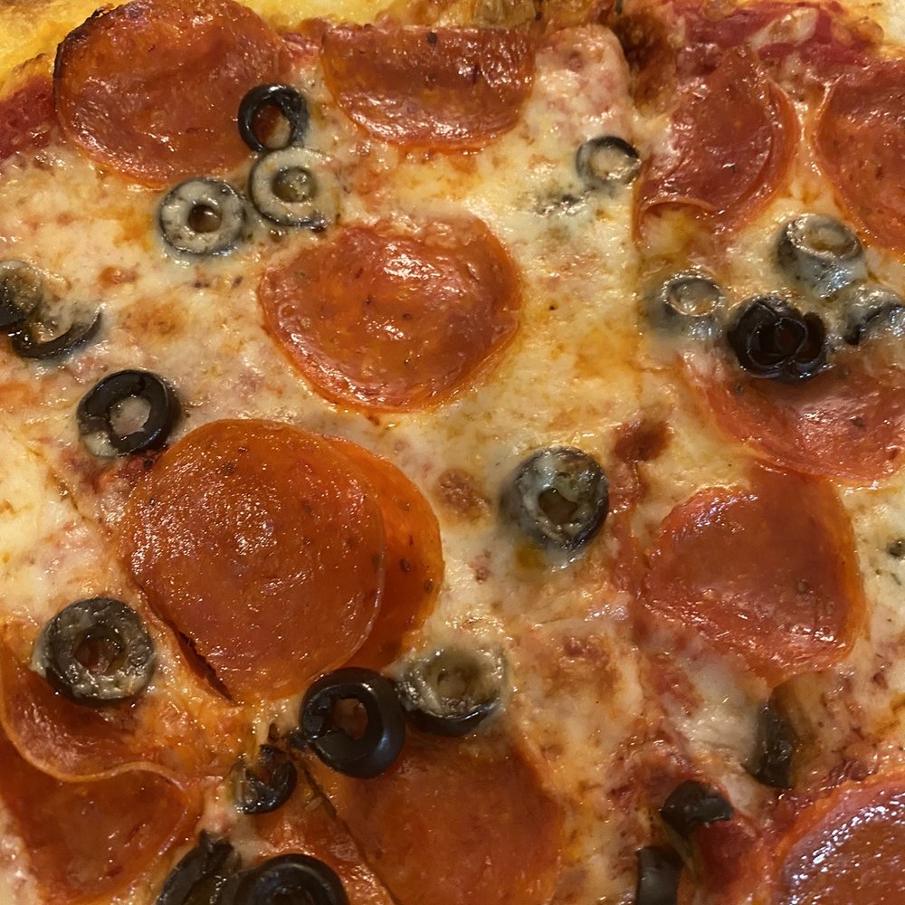 Giovanni's Pizza & Pasta - Pepperoni and black olives - Italian Near Me - Flagler Beach, Florida Giovanni's Pizza & Pasta - Pepperoni and black olives - Italian Near Me - Flagler Beach, Florida
