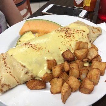 Speggtacular - Bacon and Monterey Jack Omelette wrapped in a crepe with hollandaise sauce - Breakfast & Brunch Near Me - Largo, Florida Speggtacular - Bacon and Monterey Jack Omelette wrapped in a crepe with hollandaise sauce - Breakfast & Brunch Near Me - Largo, Florida