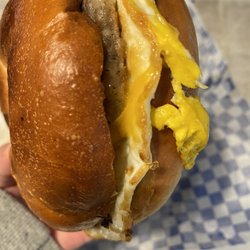 Sweet Bakery - Breakfast sandwich- sausage, egg and cheddar on a plain bagel
