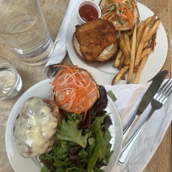 Sisters - Fried Chicken Sandwich (bottom plate with salad) and Fried Fish Sandwich (top plate with fries) - Music Venues Near Me - Brooklyn, New York