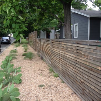 Viking Fence - Cedar fence built by Viking (after a year of weathering). 2" slats, 3/4" inch apart, posts every 8 feet. 1x6 top cap and side caps. - Fences & Gates Near Me - Austin, Texas