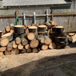 A-1 Ron's Stump & Tree Removal - nicely packed tree logs.