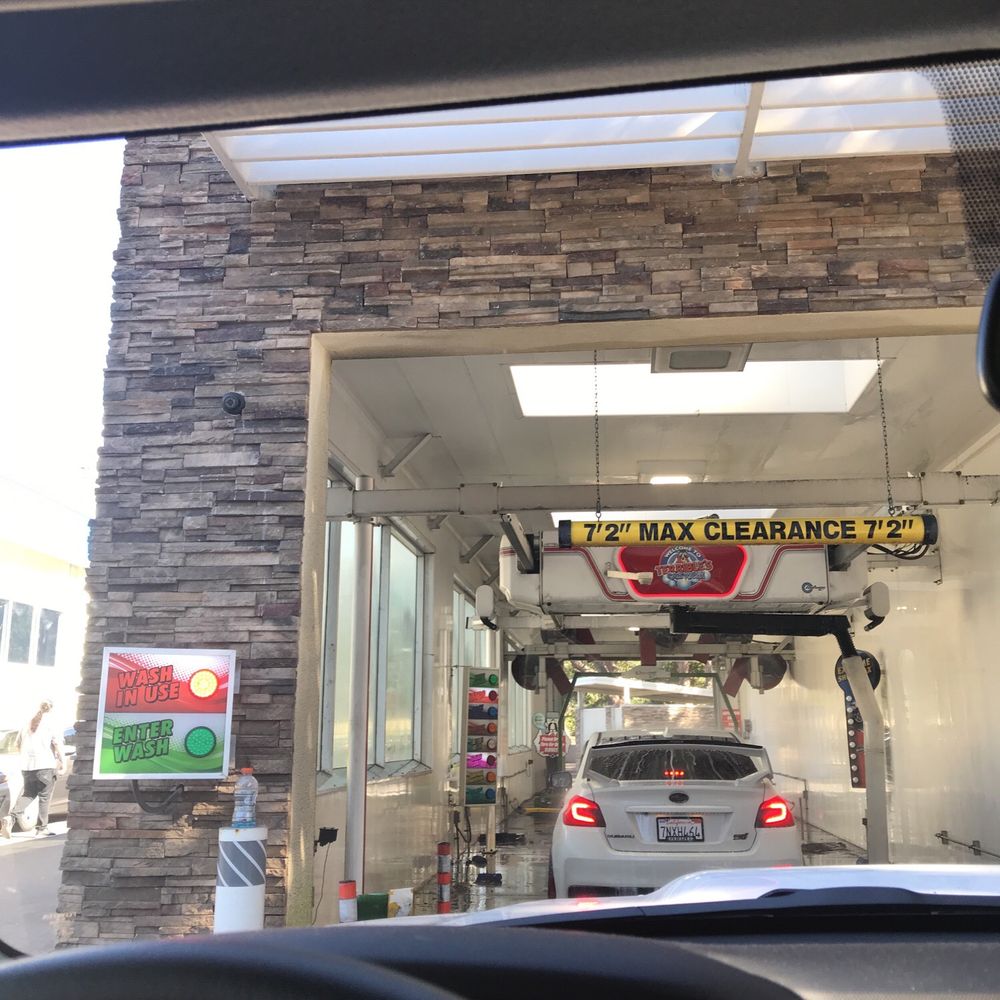 a car in a car wash station a car in a car wash station