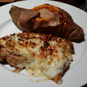 LongHorn Steakhouse - parmesan crusted chicken with baked sweet potato and cinnamon - Steakhouses Near Me - Castleton, Indiana