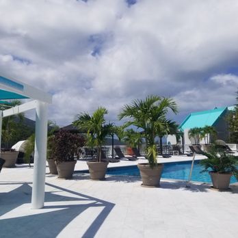 RooT42 - View from our table looking at the ocean beyond the pool and waterfall - Bars Near Me - St Thomas, Virgin Islands