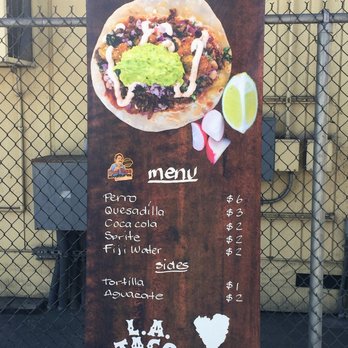 Perro 110 - a taco menu on a sign - Tacos Near Me - Los Angeles, California