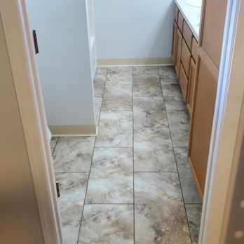Eagle Eye Construction - Laptop flooring and rubber base in bathroom - General Contractors Near Me Eagle Eye Construction - Laptop flooring and rubber base in bathroom - General Contractors Near Me