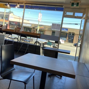 Adam's Crepes - a table and chairs in front of a window - Creperies Near Me - Burnaby, British Columbia