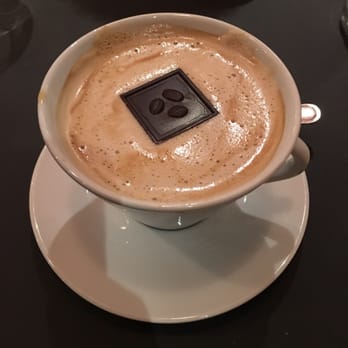 Le Bosquet - Coffee with milk, sugar, chocolate square (and an added shot of Bailey's) - Bars Near Me - Paris, 75 Le Bosquet - Coffee with milk, sugar, chocolate square (and an added shot of Bailey's) - Bars Near Me - Paris, 75