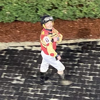 Fair Grounds Race Course & Slots - A jockey after his race....the track was super muddy after the heavy rains today. - Horse Racing Near Me - New Orleans, Louisiana Fair Grounds Race Course & Slots - A jockey after his race....the track was super muddy after the heavy rains today. - Horse Racing Near Me - New Orleans, Louisiana