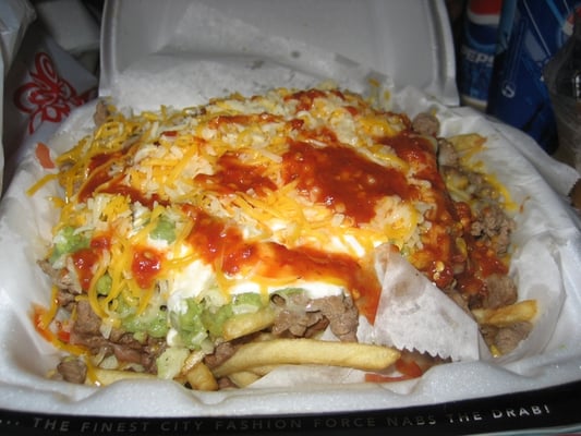 Photo of Cotija's Taco Shop - San Diego, CA, US. Carne Asada Fries with hot sauce
