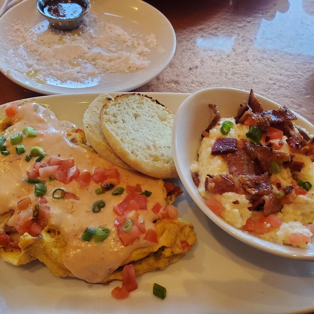 Another Broken Egg Cafe - Mardi Gras Omelet with city grits! So good! - Breakfast & Brunch Near Me - The Colony, Texas Another Broken Egg Cafe - Mardi Gras Omelet with city grits! So good! - Breakfast & Brunch Near Me - The Colony, Texas