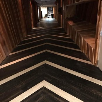 A&R Flooring Buford - a hallway with a chevron pattern - Flooring Near Me - Buford, Georgia