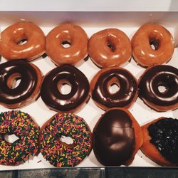 Krispy Kreme - Original Glazed, Chocolate Glazed, Chocolate Glazed with Sprinkles, Filled Chocolate Glazed, Oreo Donuts (Left to Right)