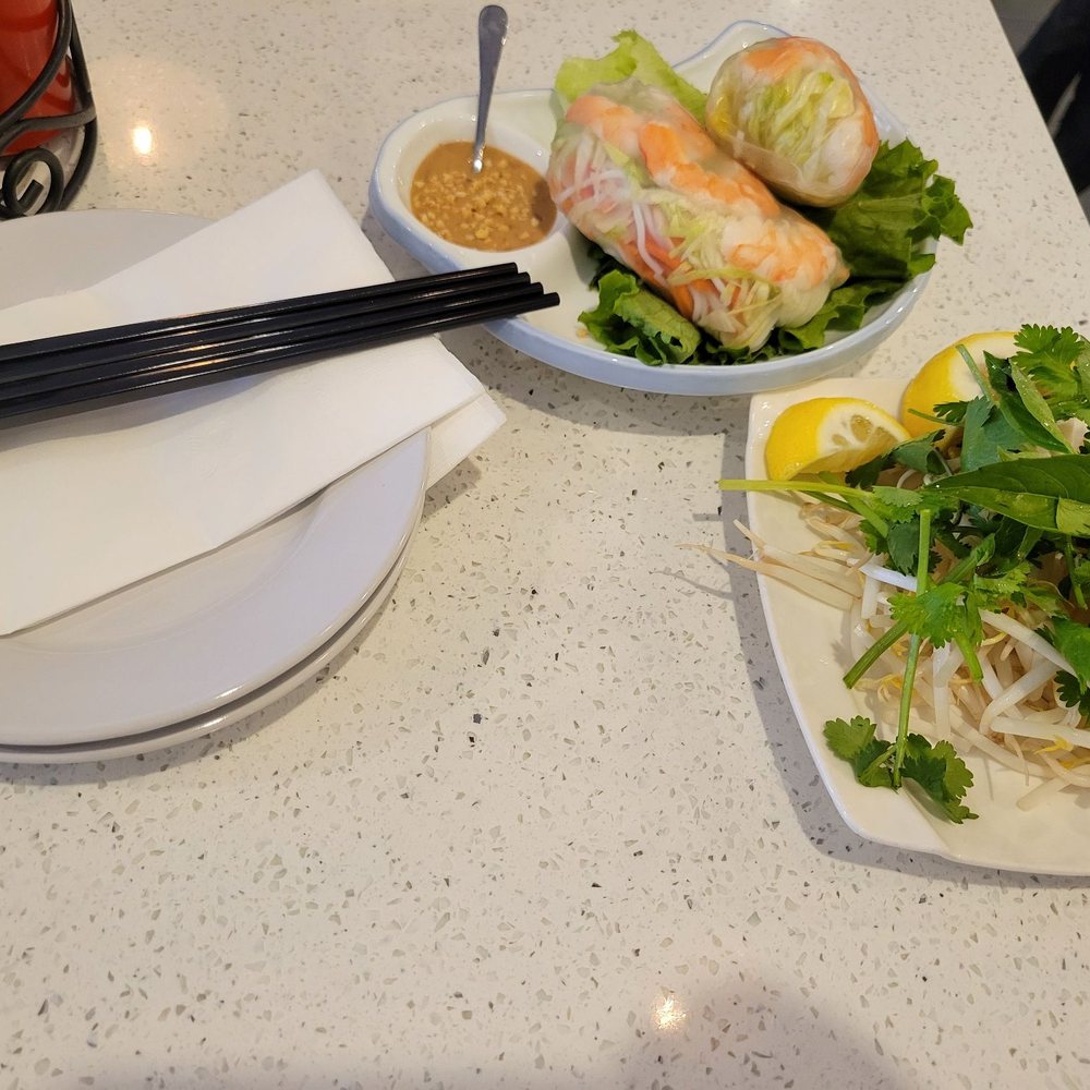 Pho Thai - two plates of food and chopsticks - Vietnamese Near Me - Rego Park, New York Pho Thai - two plates of food and chopsticks - Vietnamese Near Me - Rego Park, New York