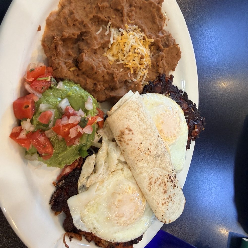 Southern Belle Diner - Chorizo hash with refried beans and guacamole (potatoes not pictured) - Breakfast & Brunch Near Me - Lancaster, New York Southern Belle Diner - Chorizo hash with refried beans and guacamole (potatoes not pictured) - Breakfast & Brunch Near Me - Lancaster, New York