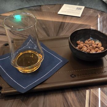 Chase Sapphire Lounge - Milam and Greene Bourbon with candied pecans - Airport Lounges Near Me - Grapevine, Texas