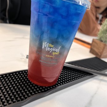 The Magical Spot - a blue and red drink in a plastic cup - Juice Bars & Smoothies Near Me - Mineola, New York The Magical Spot - a blue and red drink in a plastic cup - Juice Bars & Smoothies Near Me - Mineola, New York