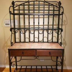 Bakers rack. Looks incredible with wine bottles and nice dishes & things displayed