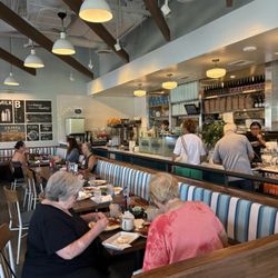 Claudine Kitchen & Bakeshop - Beautiful indoor set up of their dining area and open kitchen