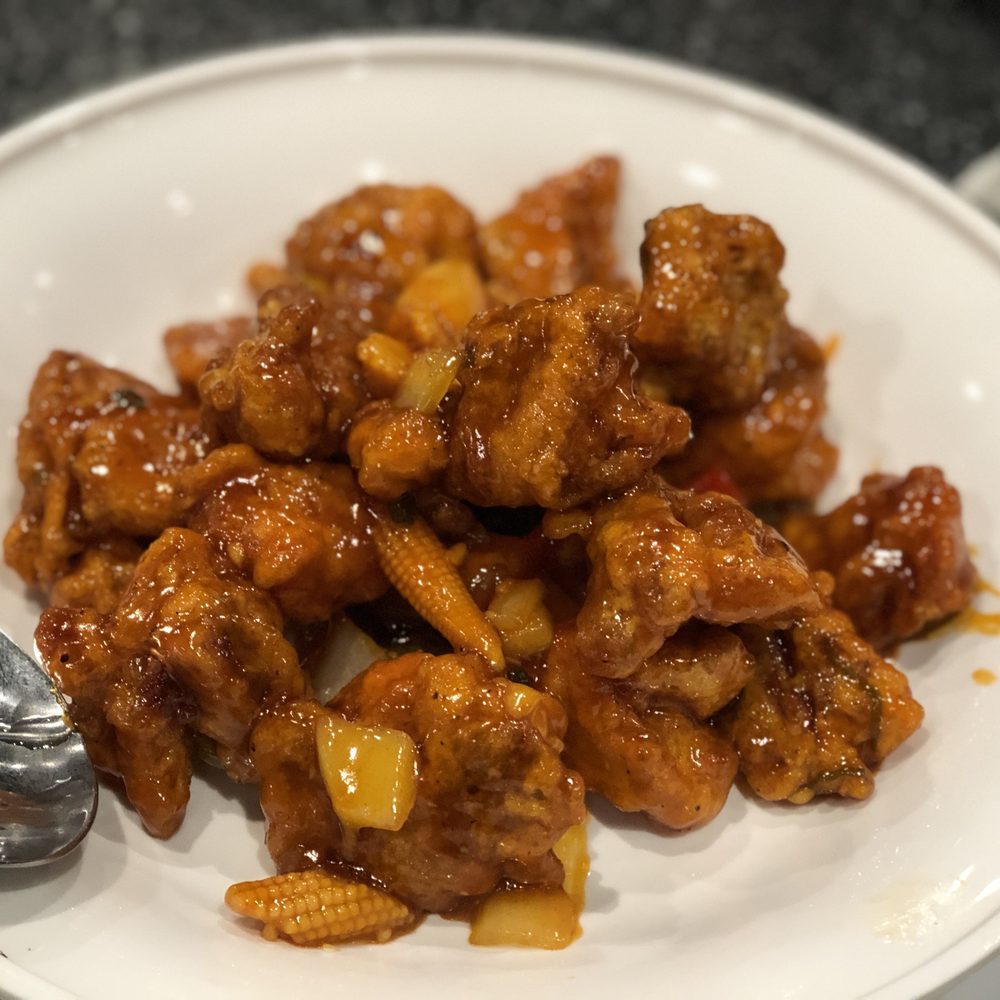 Beijing Sung - a plate of food with a spoon - Korean Near Me - Vaughan, Ontario