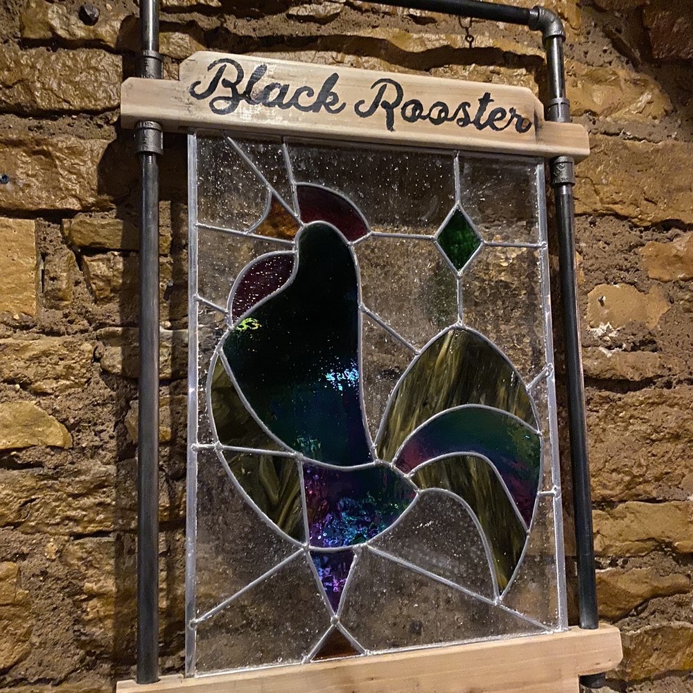 Black Rooster Bistro - a stained glass window - Wine Bars Near Me - Hudson, Wisconsin Black Rooster Bistro - a stained glass window - Wine Bars Near Me - Hudson, Wisconsin