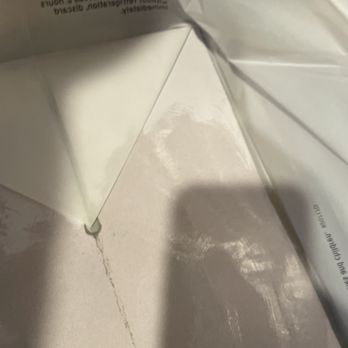 Denny's - The bottom of the bag where greasy gravy from someone else's meal got all over our food. - Diners Near Me - Corinth, Texas
