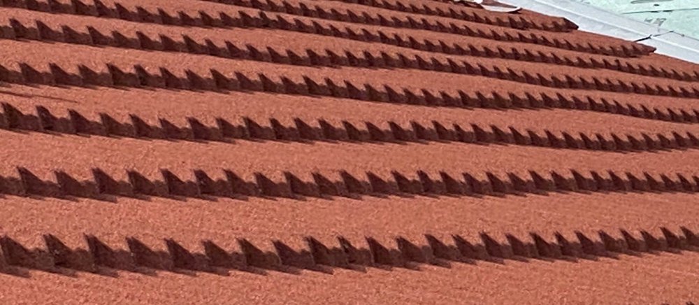 Slide of Adams Roofing