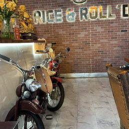 Name sign and Motorcycle displayed inside the restaurant