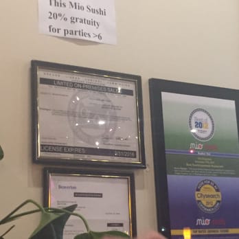 Mio Sushi - New addition on the wall since the last time I was there & threatened legal action if they charged me gratuity - Japanese Near Me - Beaverton, Oregon