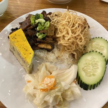 District one Saigon Street Food - Pork Chop broken rice with pork skin and egg meatloaf - Sandwiches Near Me - Carrollton, Texas District one Saigon Street Food - Pork Chop broken rice with pork skin and egg meatloaf - Sandwiches Near Me - Carrollton, Texas