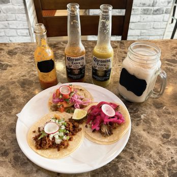 Si Senior Machete - a plate of tacos and a bottle of beer - Mexican Near Me - Maple Ridge, British Columbia Si Senior Machete - a plate of tacos and a bottle of beer - Mexican Near Me - Maple Ridge, British Columbia