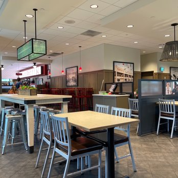 Chick-fil-A - ows tables and chairs in a restaurant - Fast Food Near Me - Jacksonville, Alabama Chick-fil-A - ows tables and chairs in a restaurant - Fast Food Near Me - Jacksonville, Alabama