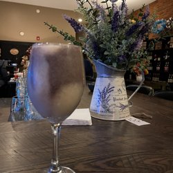 Twisted Rivers Winery - Wine slushee. Twisted grape (tastes like cool aid) and peach. Delicious! With a floral display that's for sale.